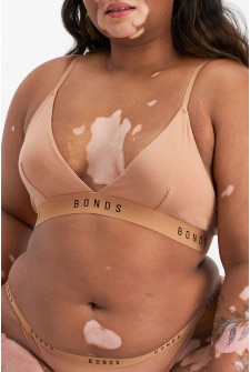 Model wears size 16, is 155cm tall with 99cm bust and 87cm waist