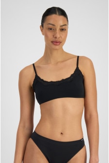 Camryn (She/Her) wears size 12B and is 177cm tall with 95cm chest and 74cm waist