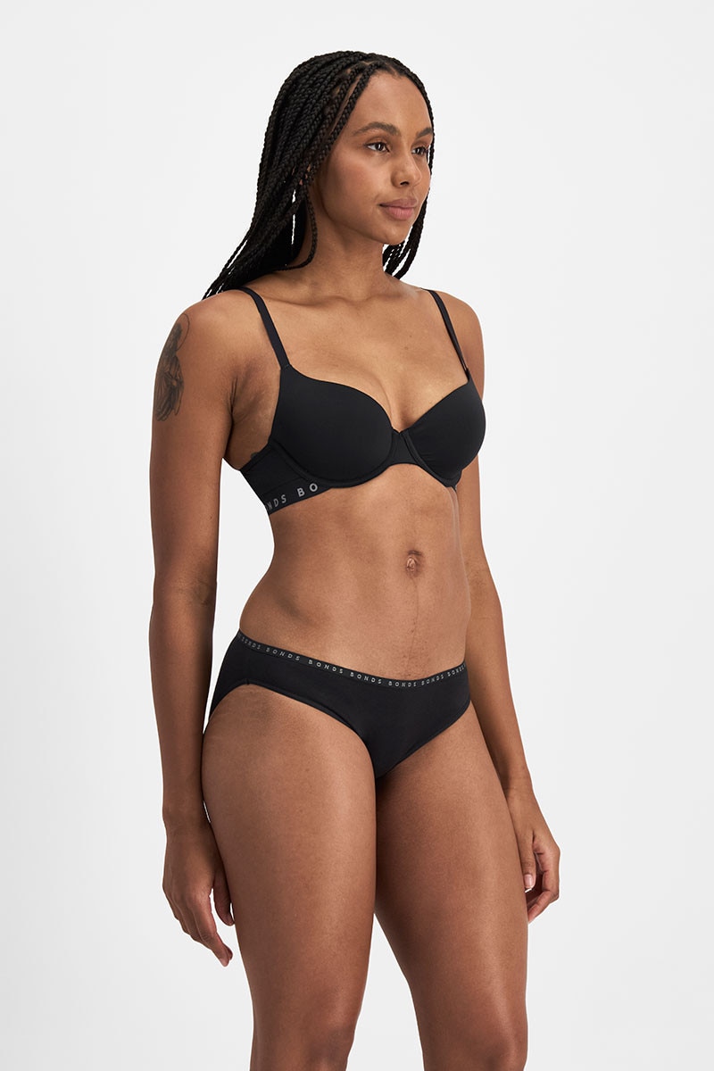 Tani (She/Her) wears size 12 and is 171cm tall with 74cm chest and 61cm waist